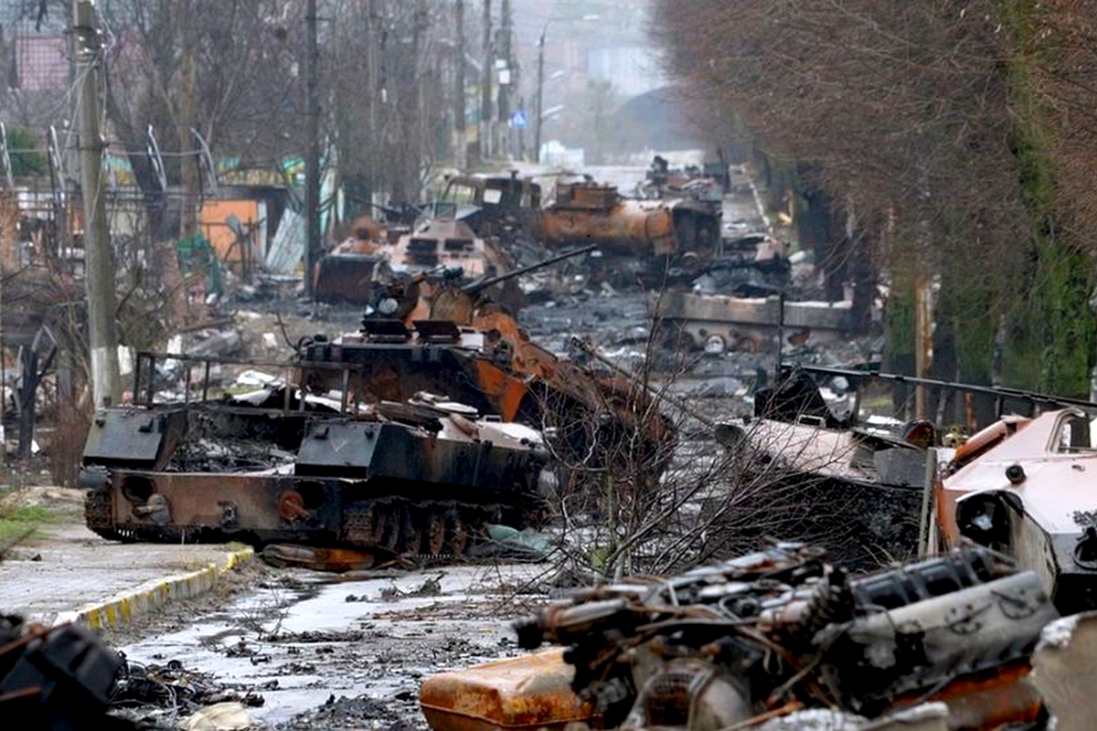 Ukrainian street littered with burned-out tanks and corpses